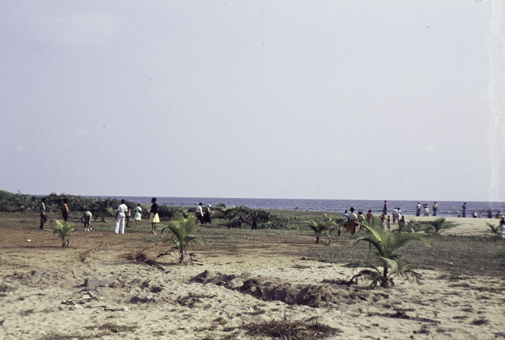 Young Liberians gathered on a beach near Robertsport